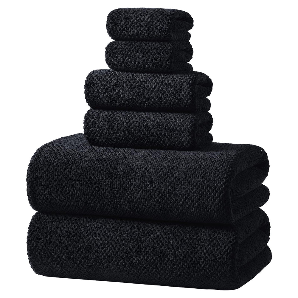 REDKISS front view of black towel set showing neat stacked towels and packaging benefit