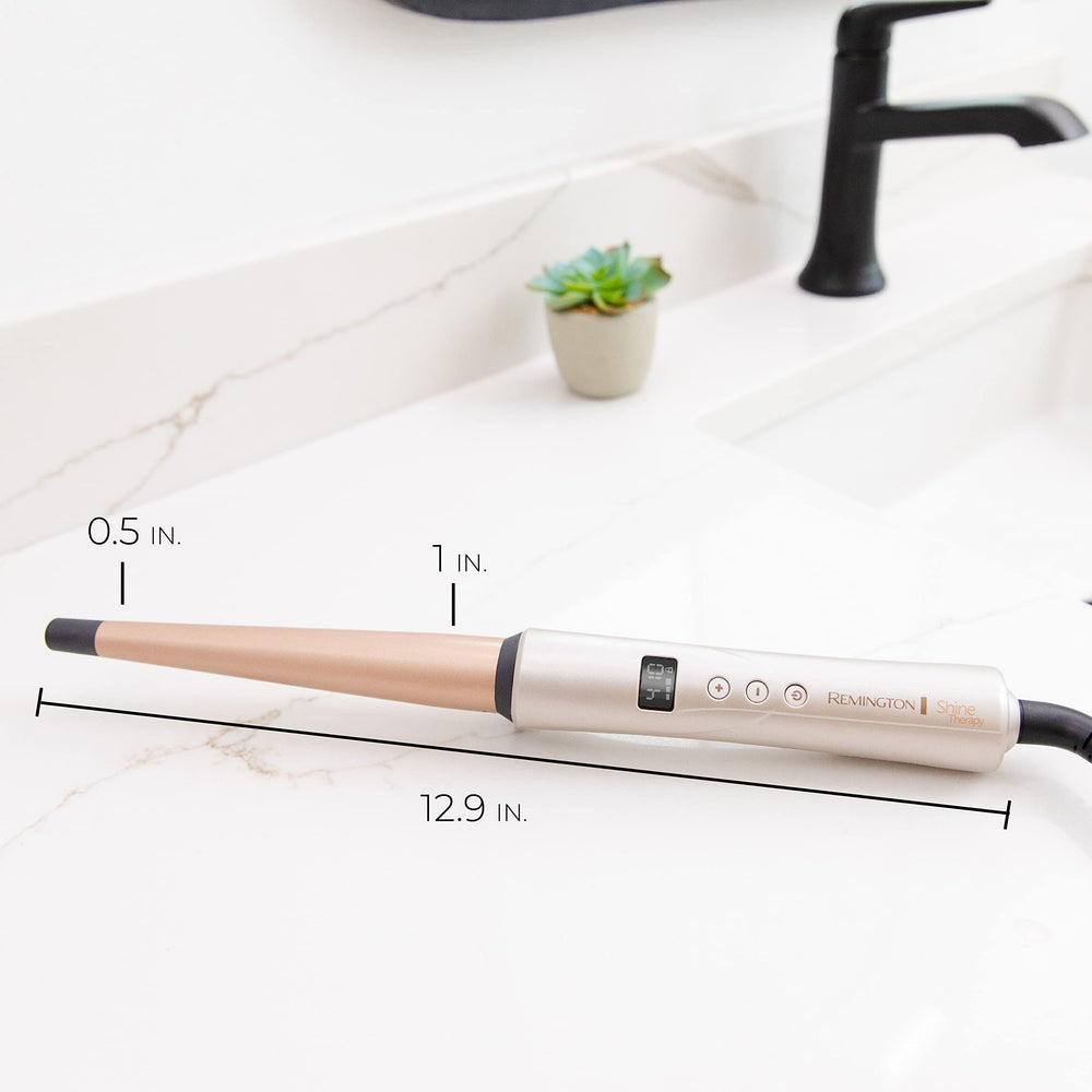 Retail packaging of Remington Shine Therapy wand showing brand and key features on box