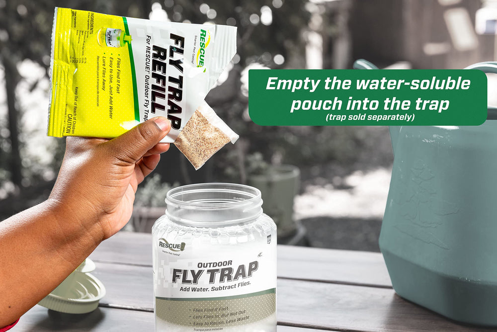 RESCUE! pouch being dropped into reusable fly trap to show simple, mess-free loading