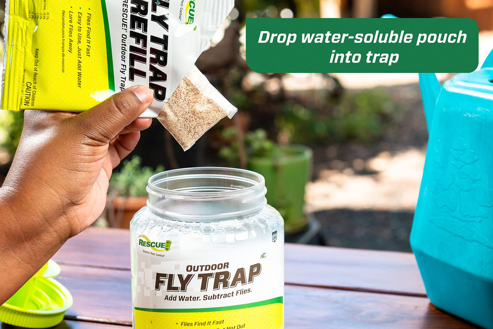 RESCUE! trap held in hand showing compact size and portability benefit