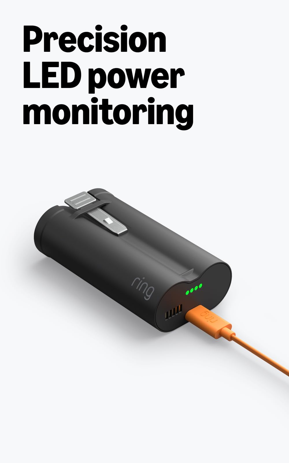 Ring battery next to hand for scale illustrating compact portable power