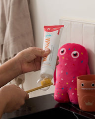 RiseWell toothpaste on brush being used by child encouraging brushing