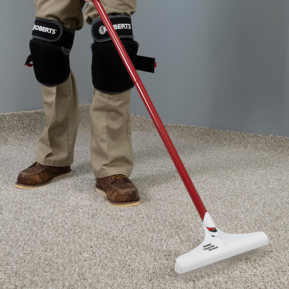 ROBERTS rake in use on living room carpet restoring pile for improved vacuuming