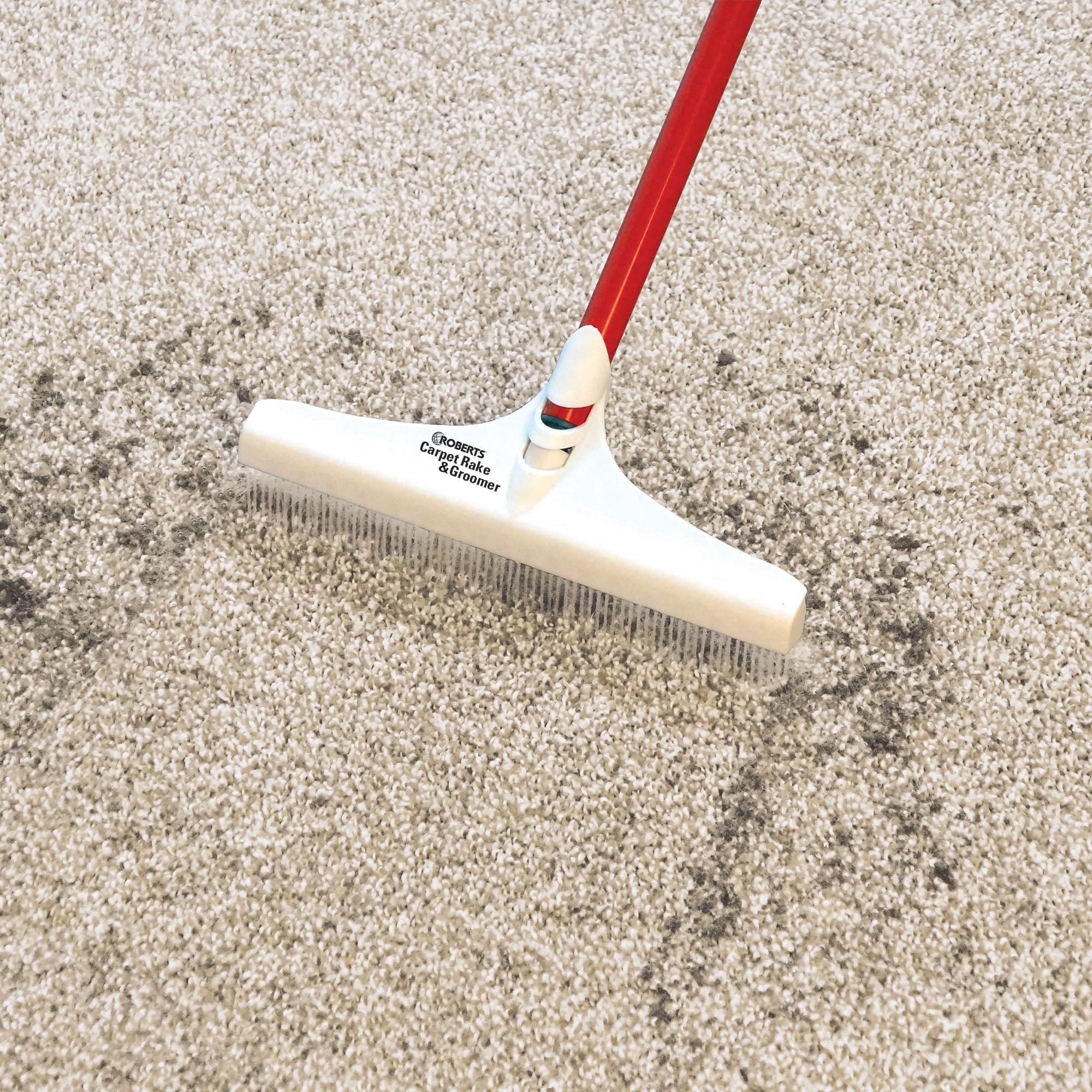 ROBERTS reach-under-sofa demo showing long handle easing access and saving time