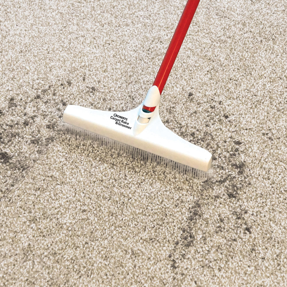 ROBERTS reach-under-sofa demo showing long handle easing access and saving time