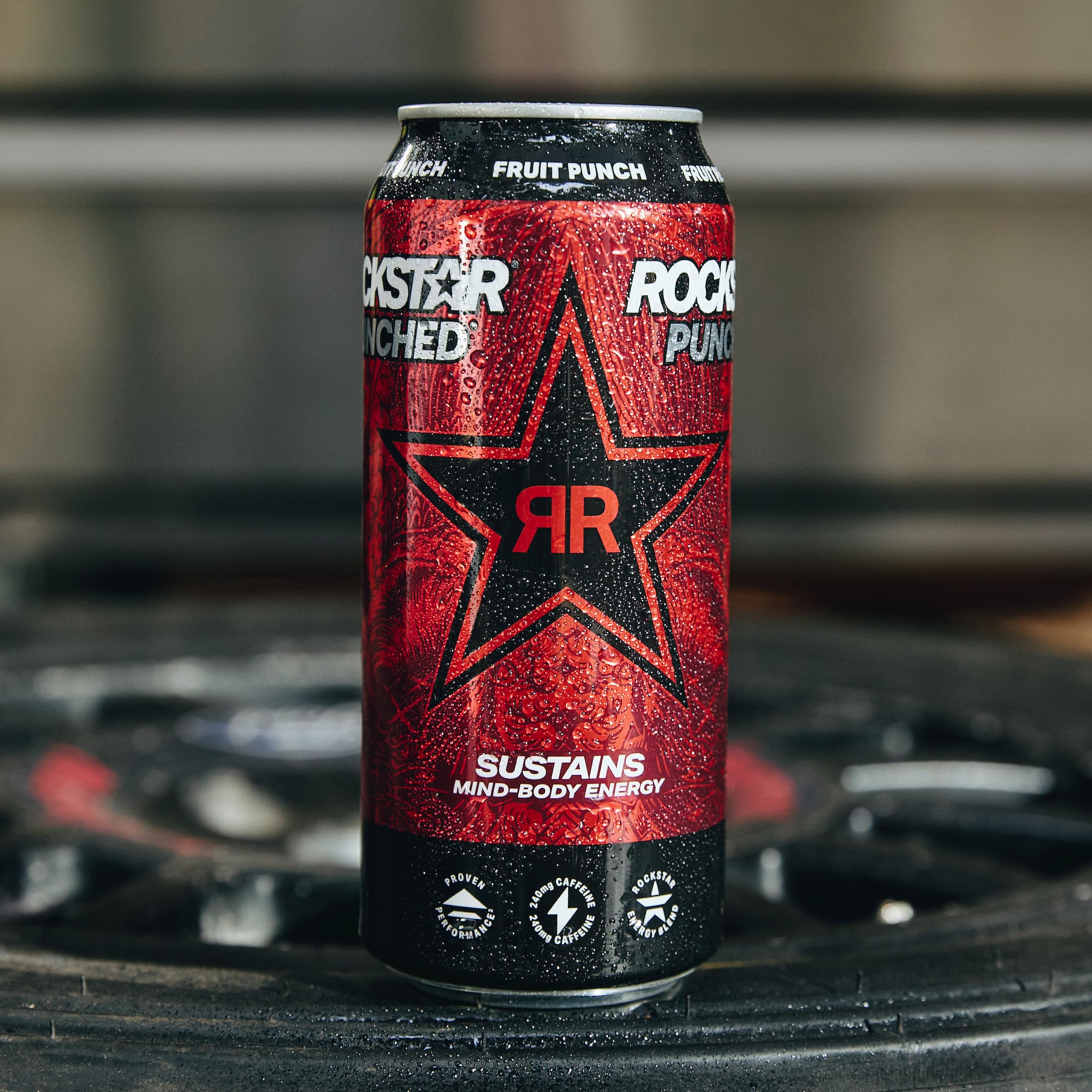 Hand holding Rockstar punched Hardcore Apple can to show size and portability