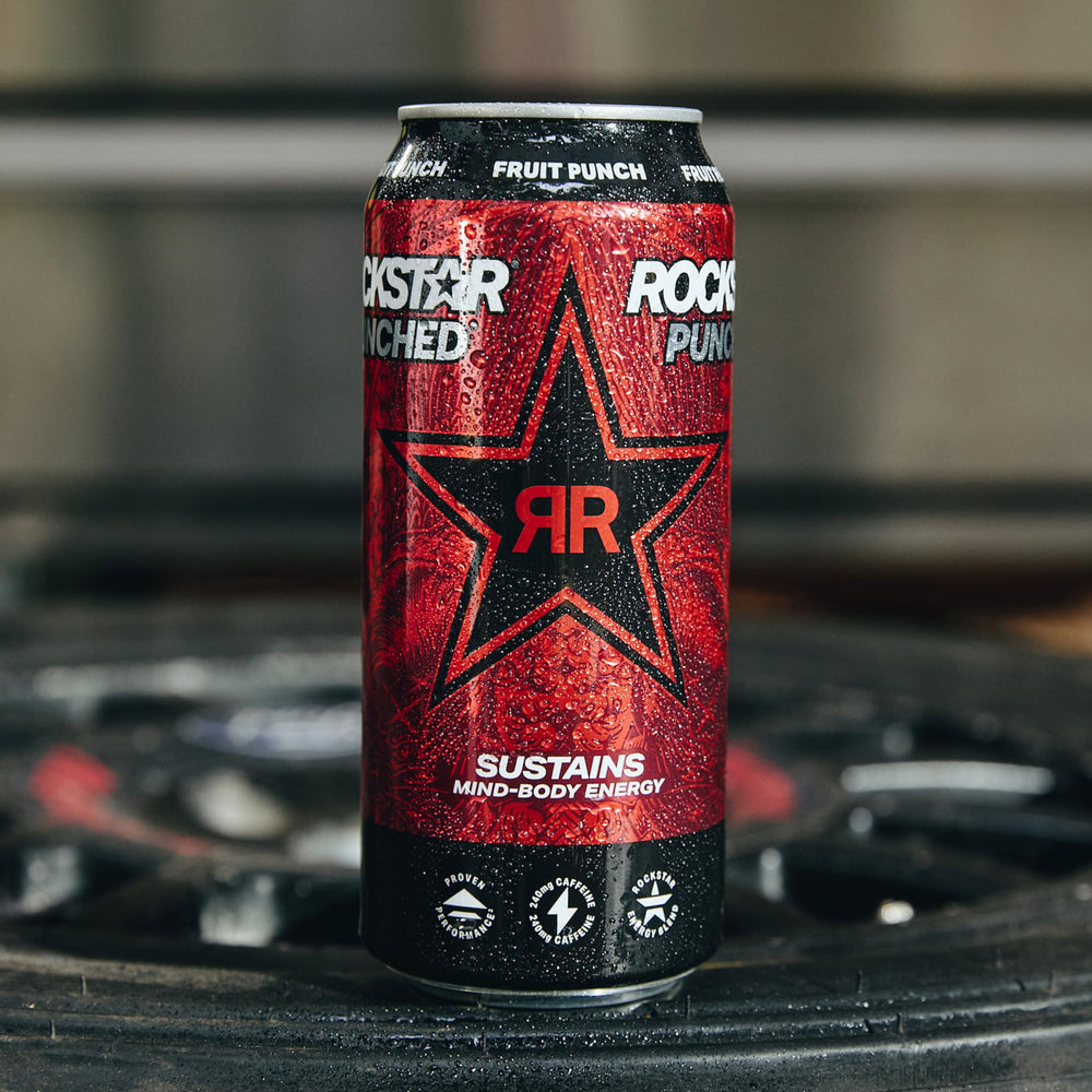 Hand holding Rockstar punched Hardcore Apple can to show size and portability