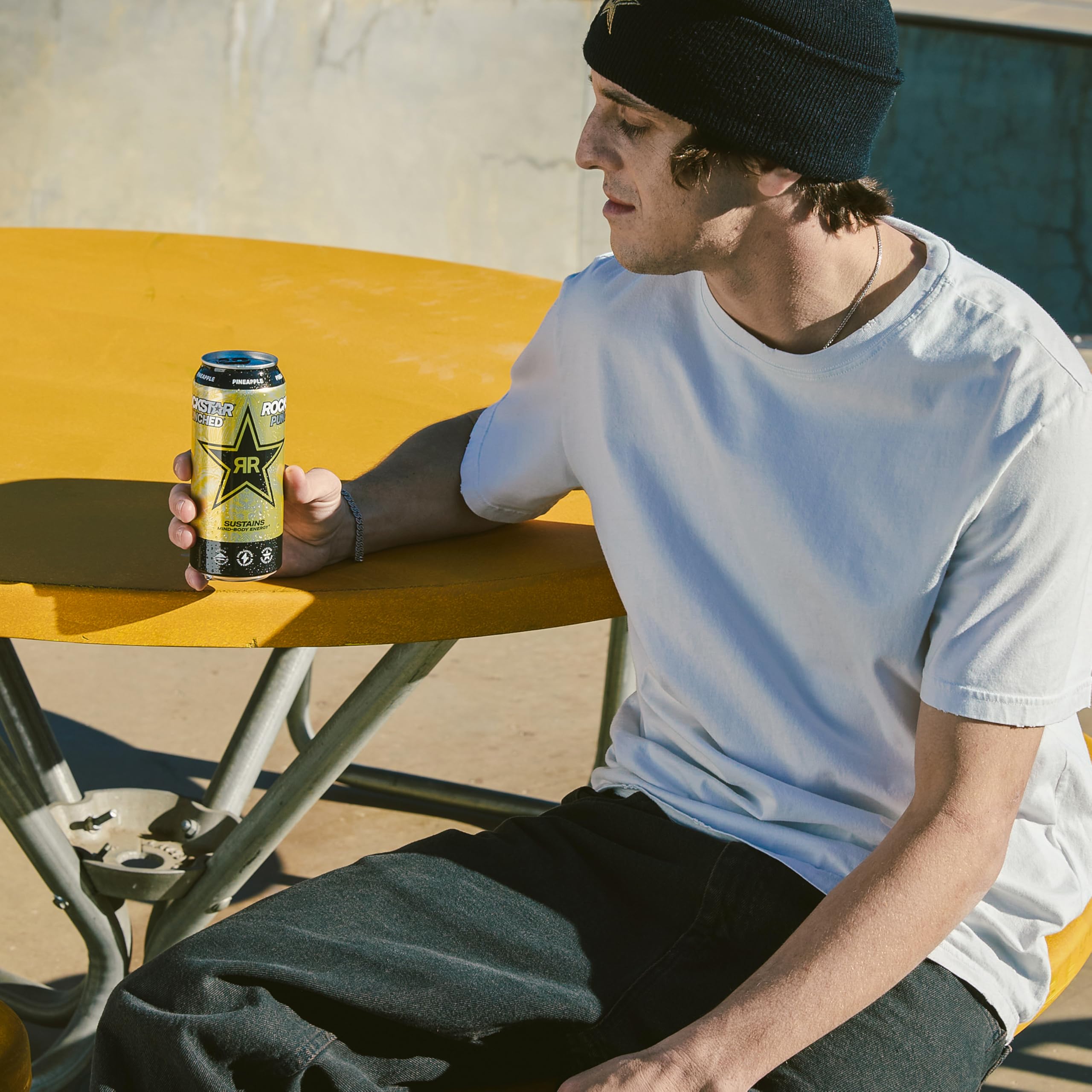 Rockstar can recycling label visible emphasizing recyclable aluminum benefit