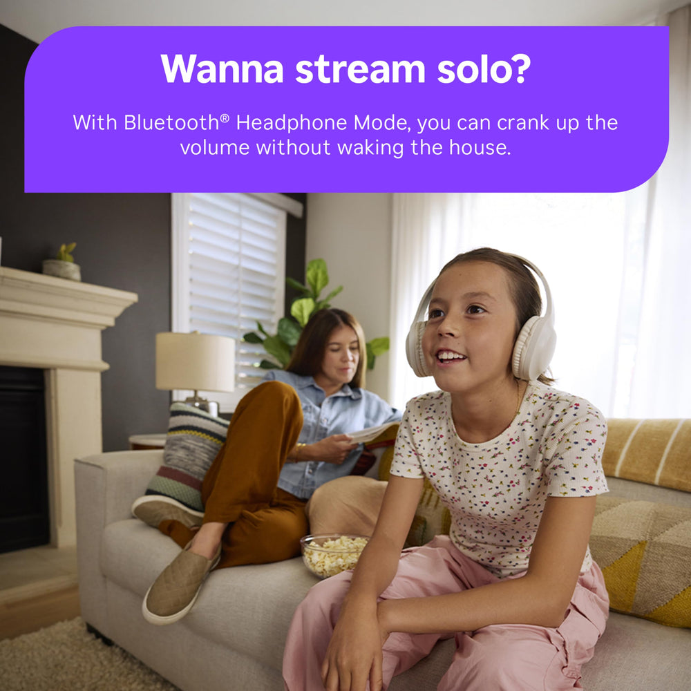 roku device near TV back panel illustrating scale and space-saving installation benefit