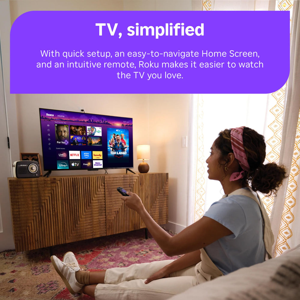 roku remote and stick on coffee table in living room showing user-friendly lifestyle setup