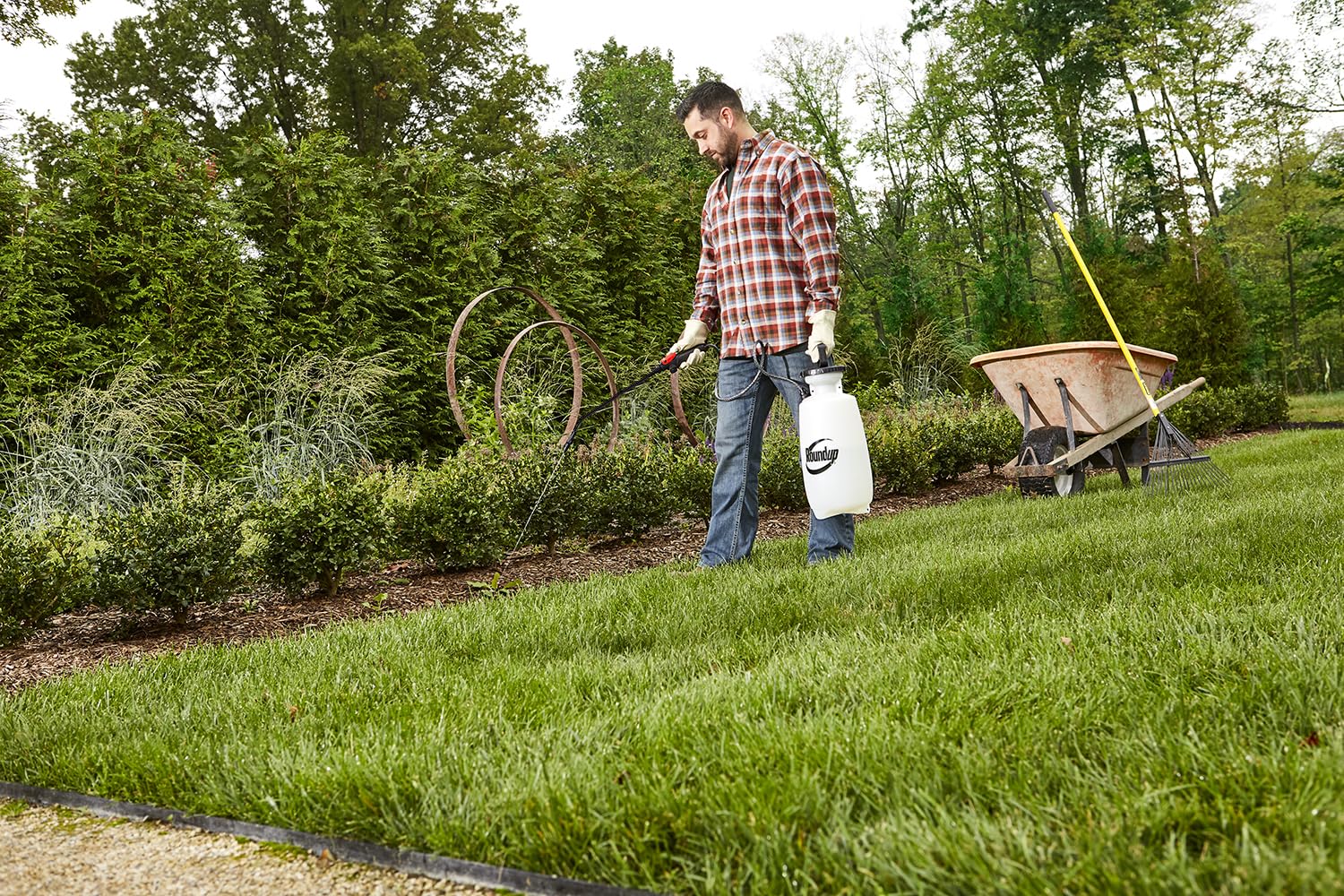 Roundup sprayer in use cleaning a deck for efficient surface cleaning