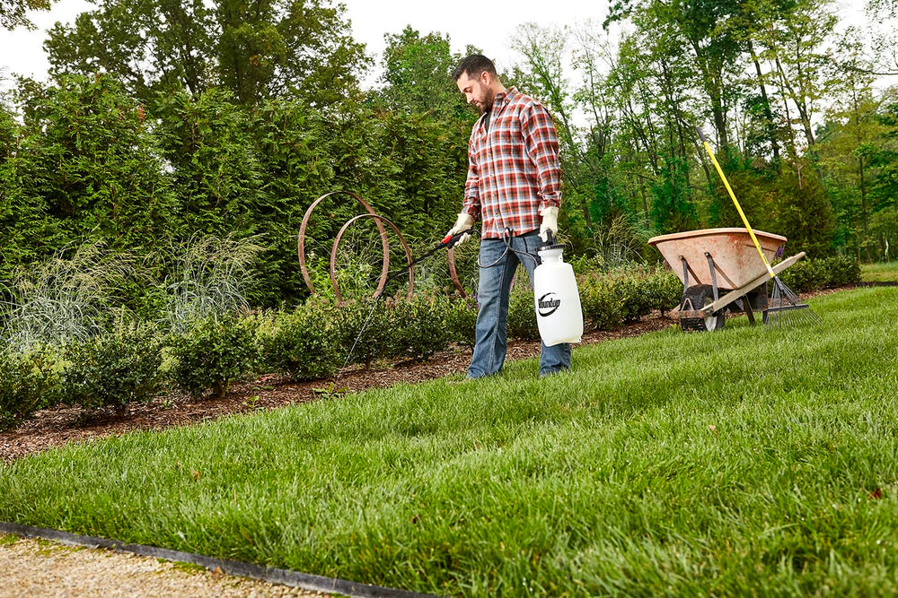 Roundup sprayer in use cleaning a deck for efficient surface cleaning