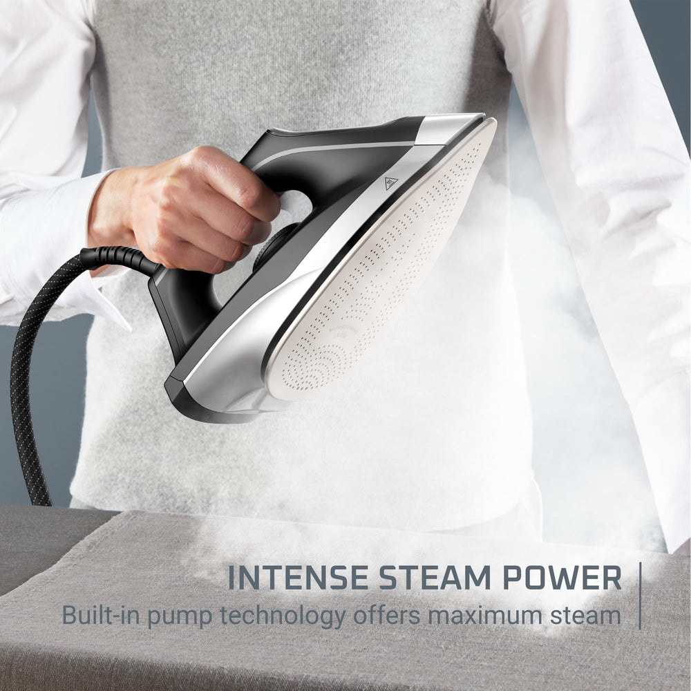 Rowenta iron releasing strong steam cloud to remove deep wrinkles quickly