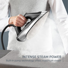 Rowenta iron releasing strong steam cloud to remove deep wrinkles quickly