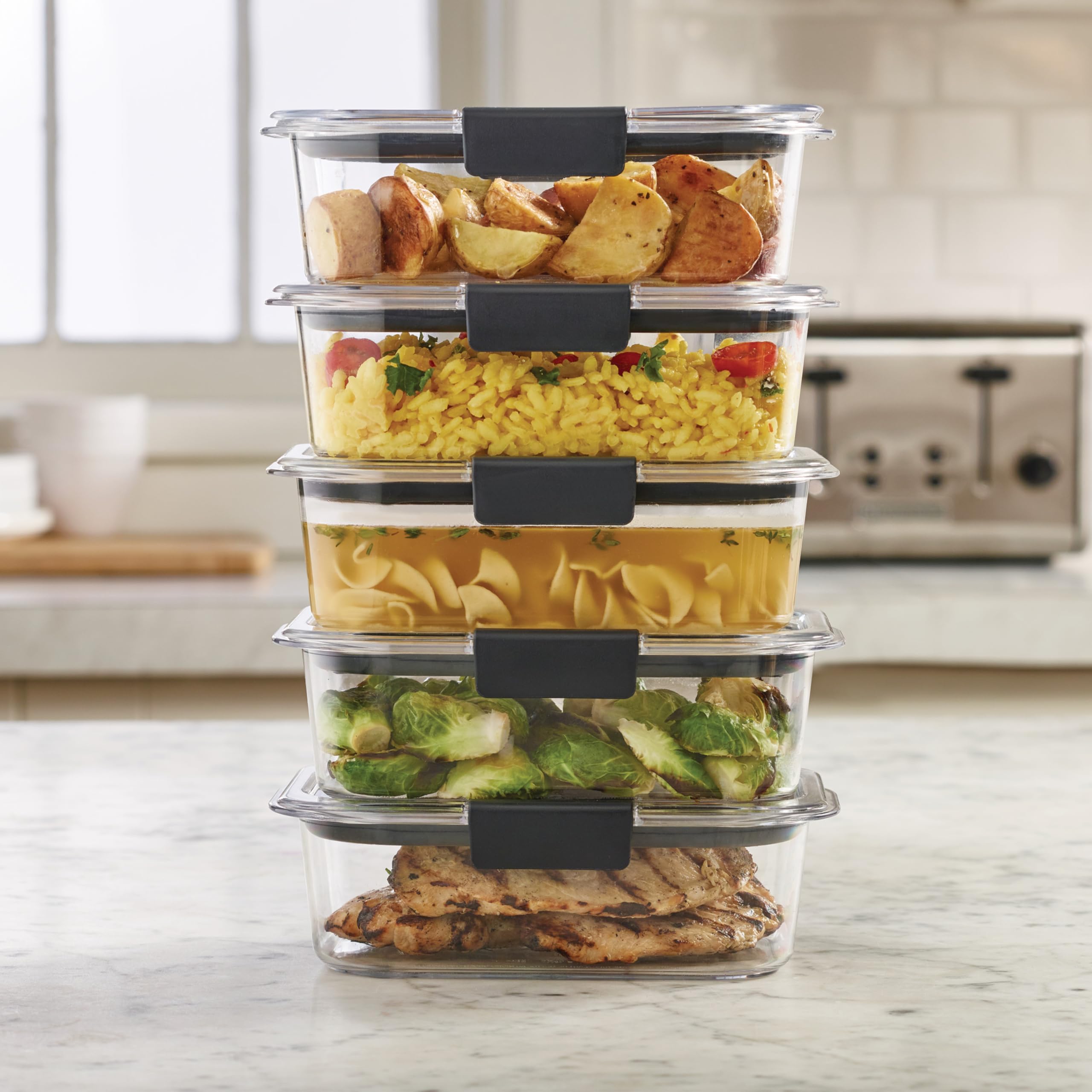 Rubbermaid Brilliance held in hand showing compact 3.2-cup portion benefit