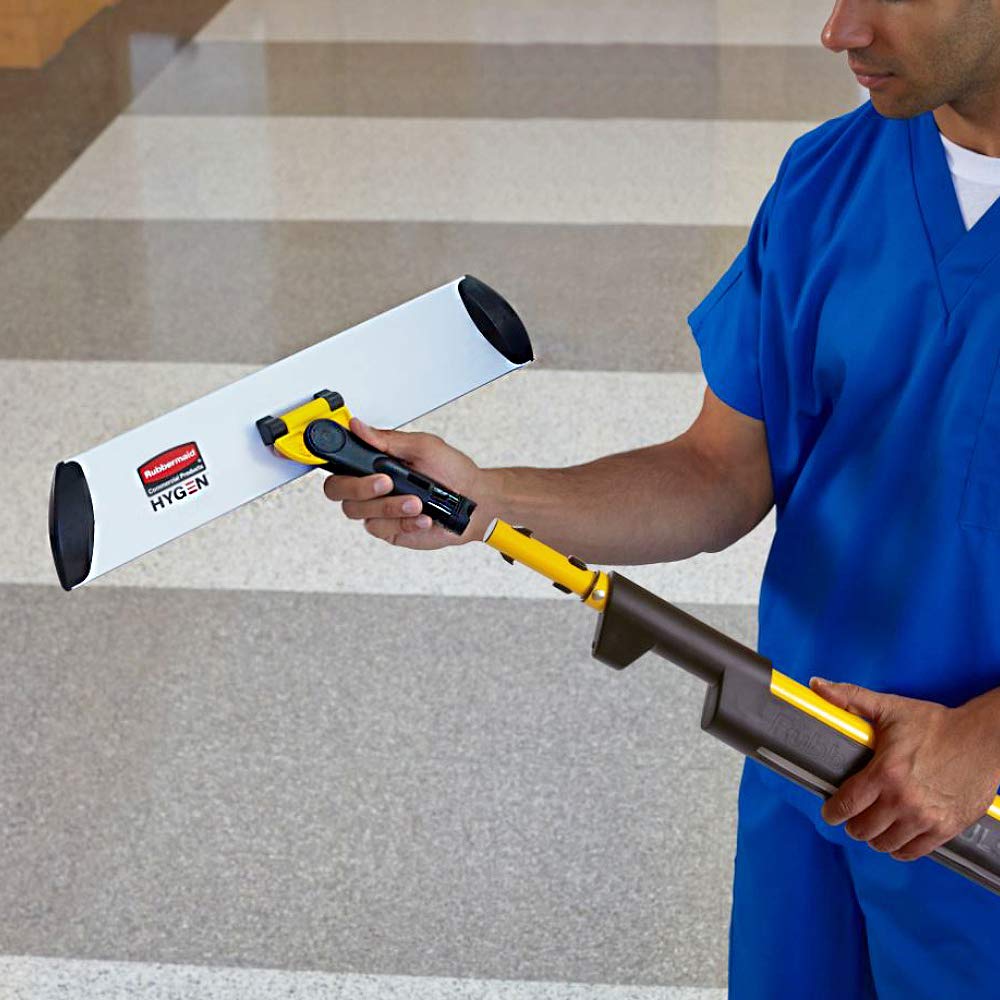Rubbermaid Commercial HYGEN in use cleaning a commercial hallway to increase cleaning speed