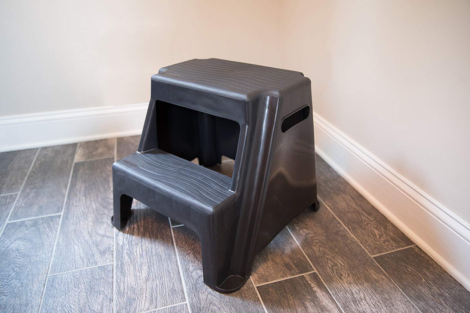Rubbermaid stool placed in kitchen near cabinets for convenient reach
