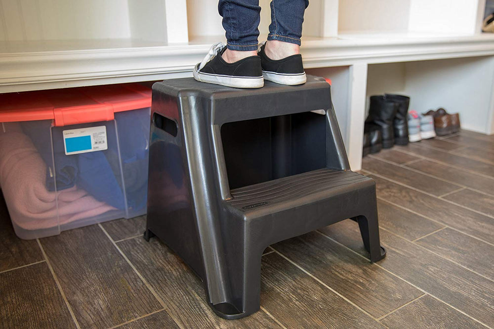 Rubbermaid stool next to person demonstrating 16-inch standing height