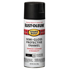 Rust-Oleum being sprayed on a metal fence providing rust protection