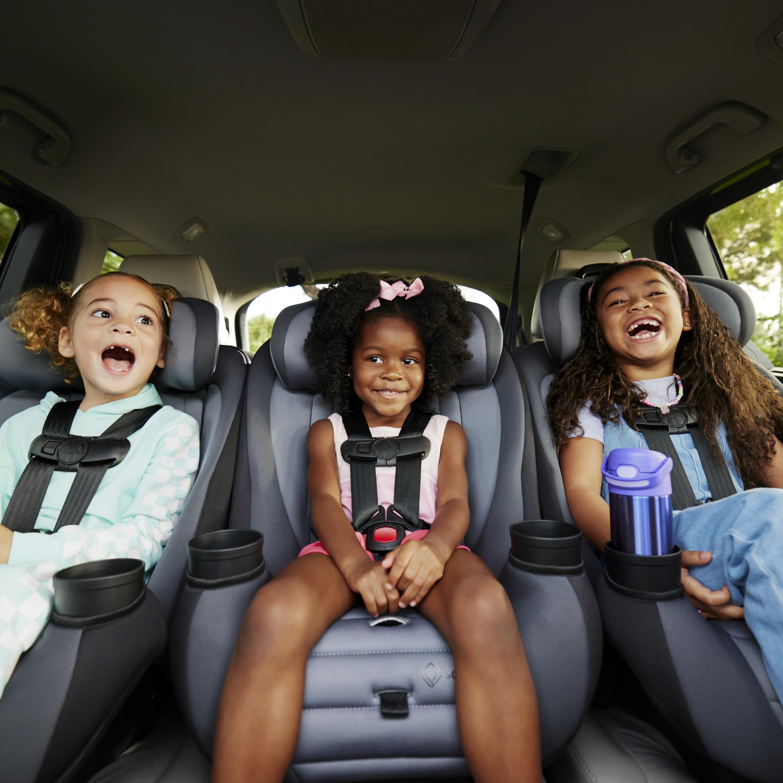 Safety 1st Ellaris seated on airplane seat illustrating travel-ready compact sizing advantage