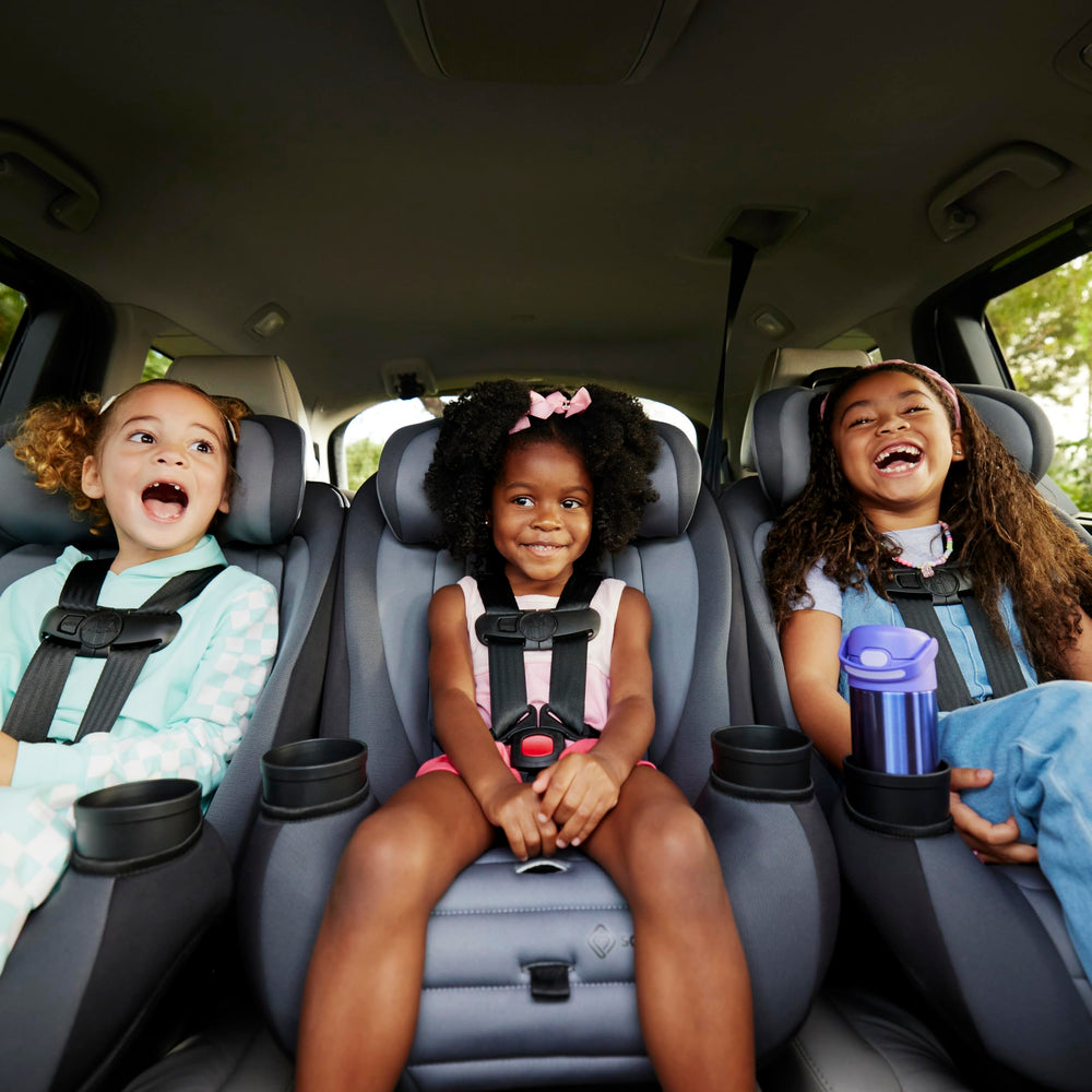 Safety 1st Ellaris seated on airplane seat illustrating travel-ready compact sizing advantage