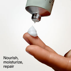 Salt & Stone tube beside a phone demonstrating travel-friendly 2 fl oz size