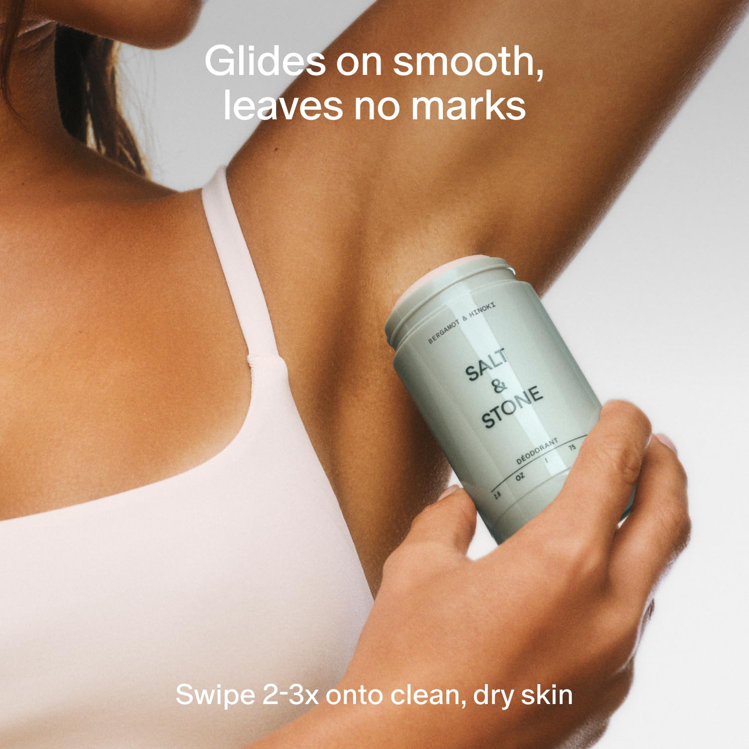Salt & Stone with a ruler showing 2.6 oz size for travel-friendly benefit