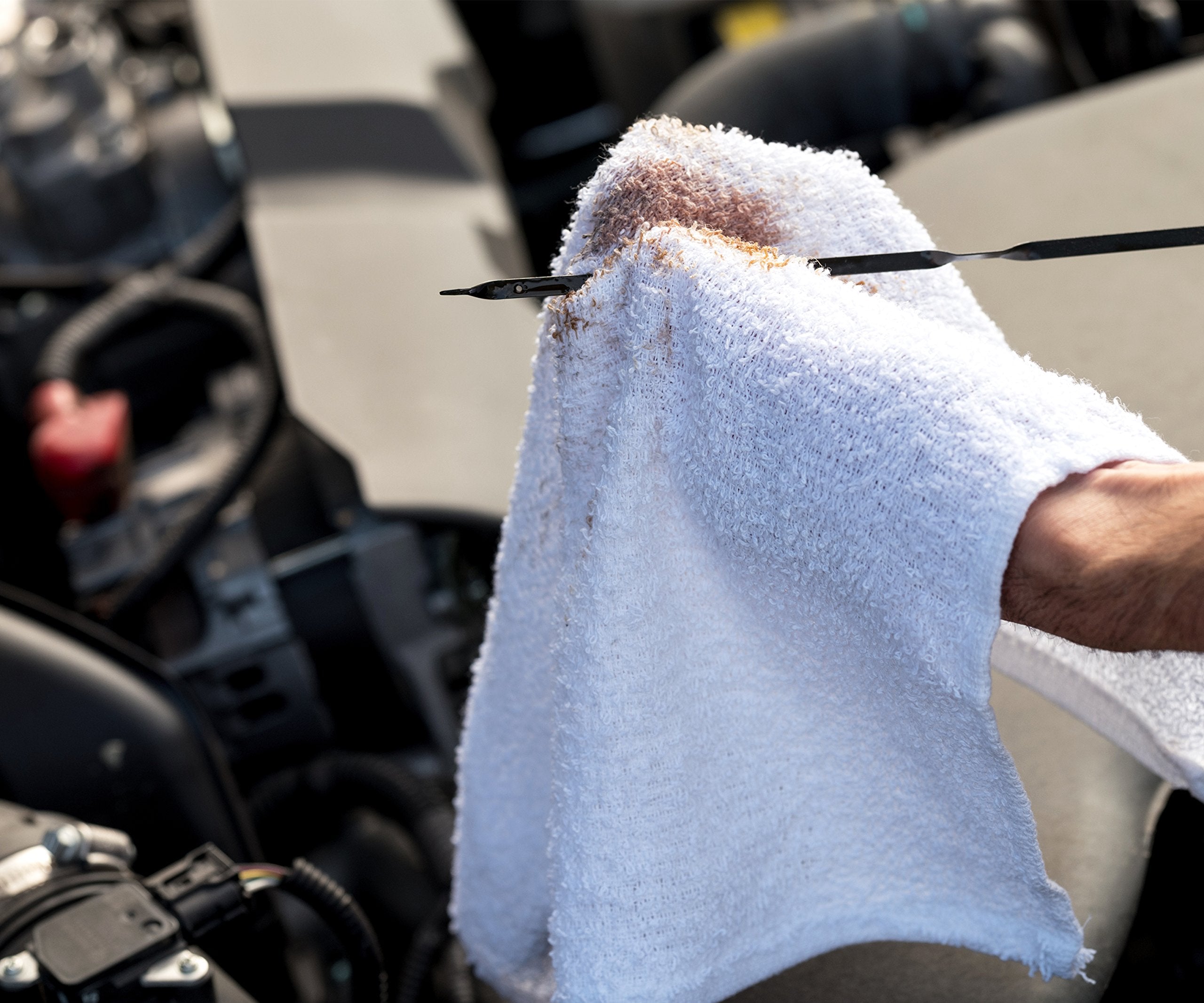 S&T INC. towel buffing stainless steel appliance showing gentle polishing advantage