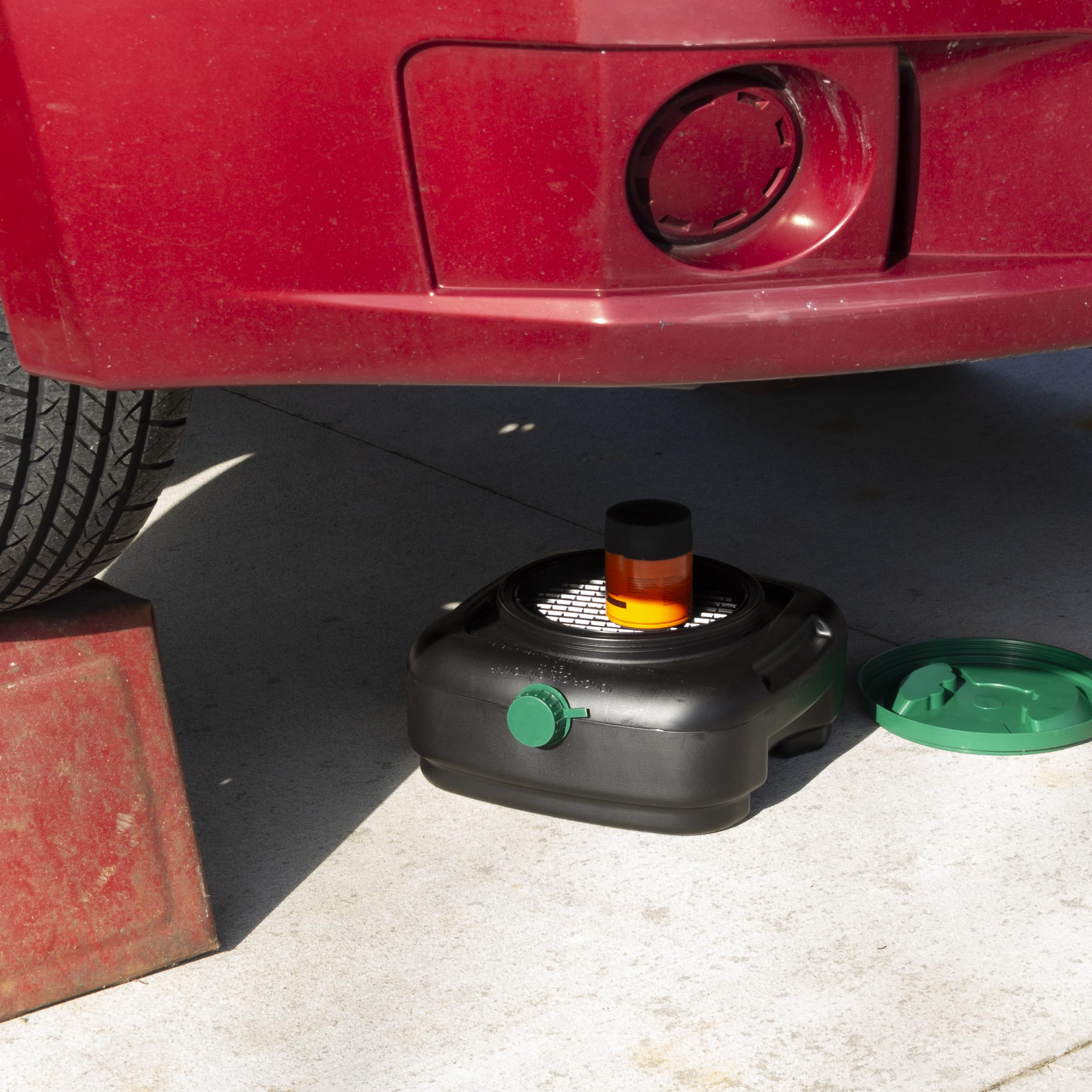 Scepter oil pan in use under vehicle capturing fluids for cleaner maintenance