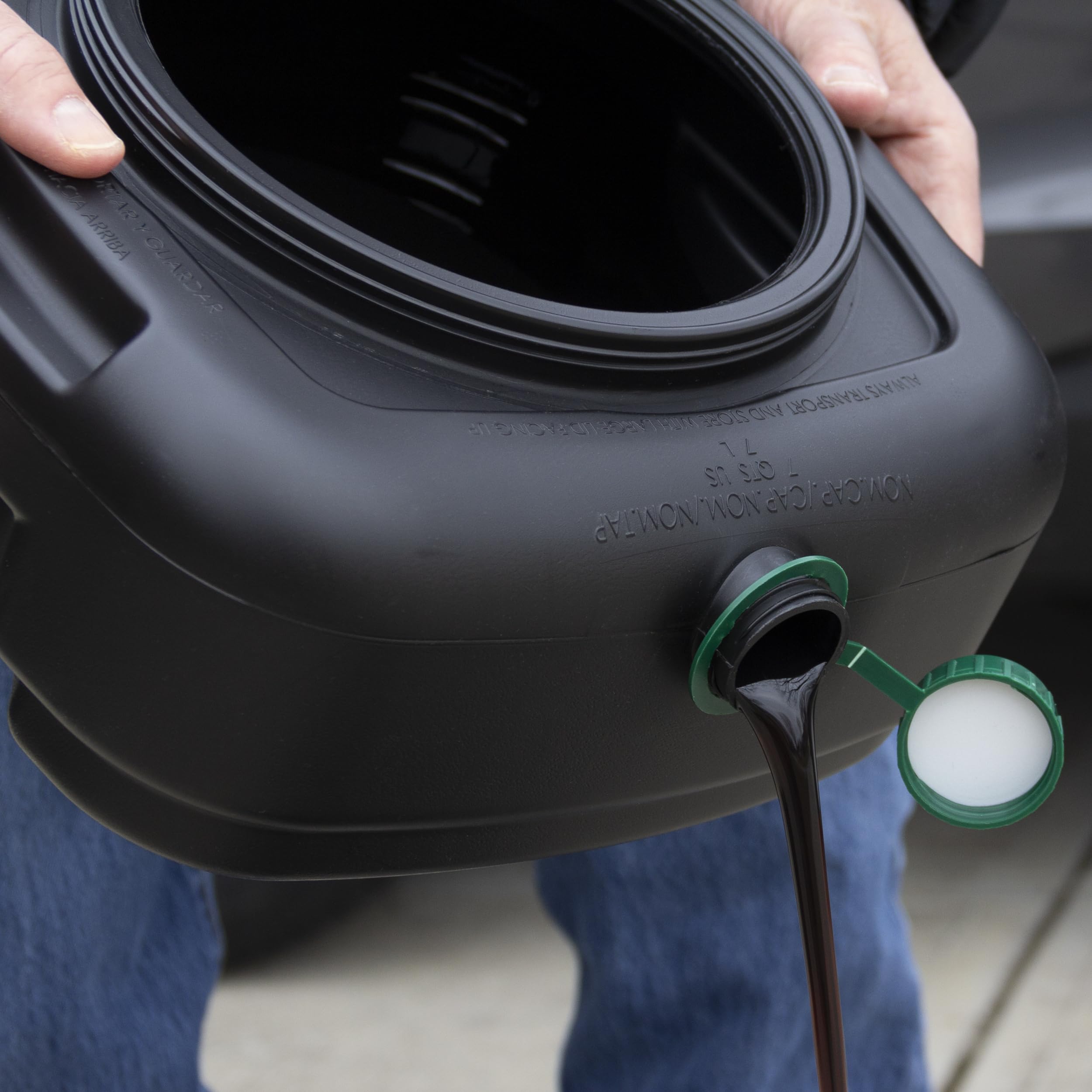 Scepter drain pan next to gallon jug showing compact size and easy recycling