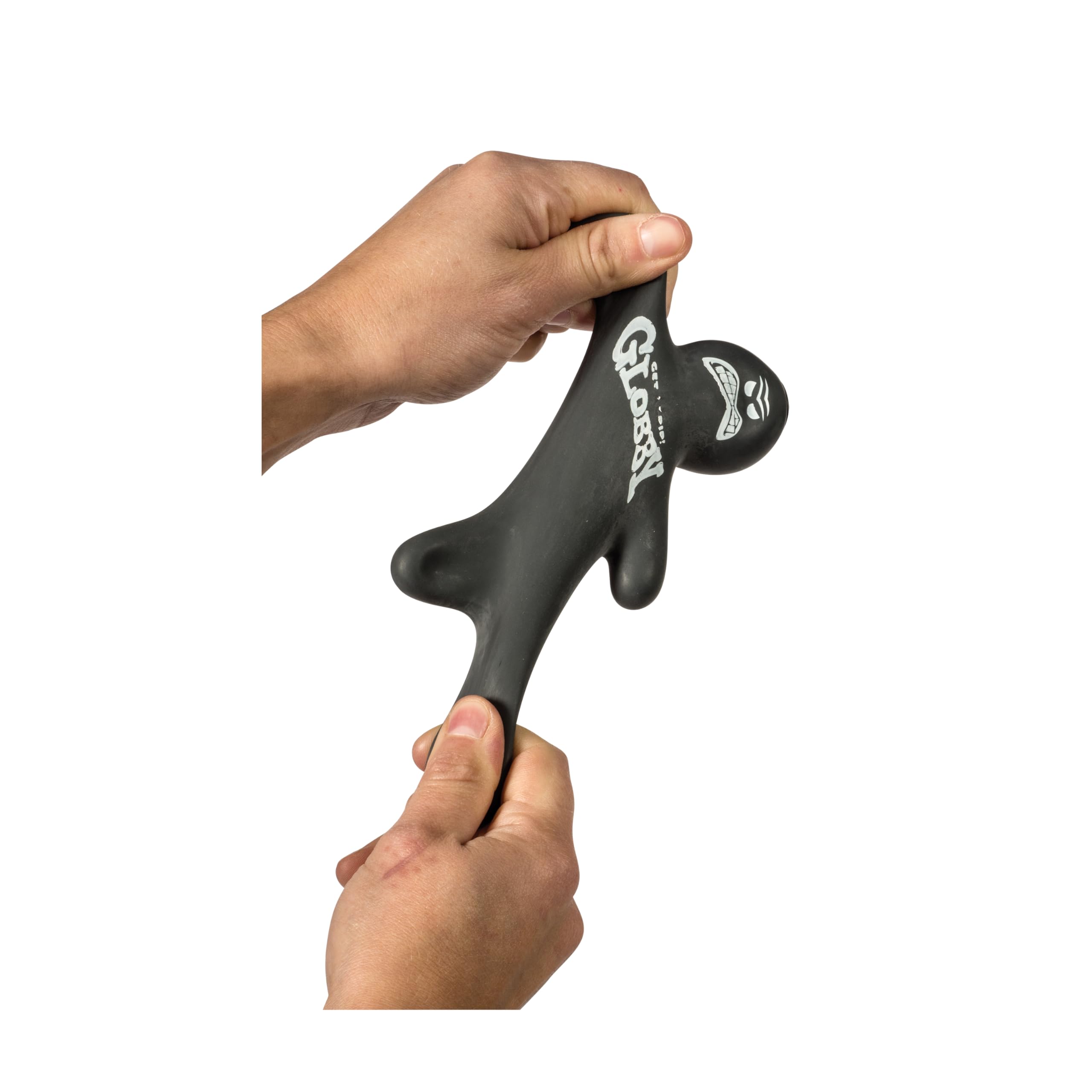 Schylling Globby on desk near notebook showing use as a discreet fidget and focus aid