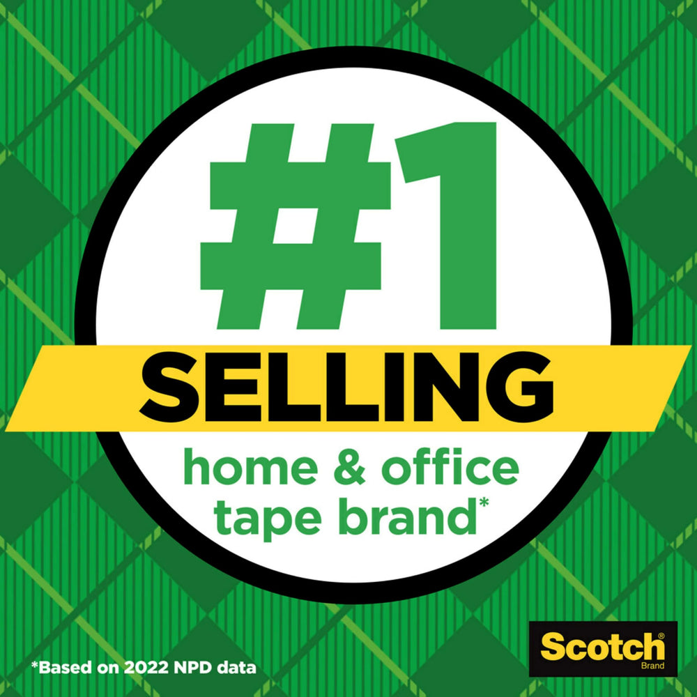 Scotch Magic tape being applied to paper for an invisible, secure mend