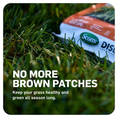 Scotts DiseaseEx being applied with a spreader for even lawn protection