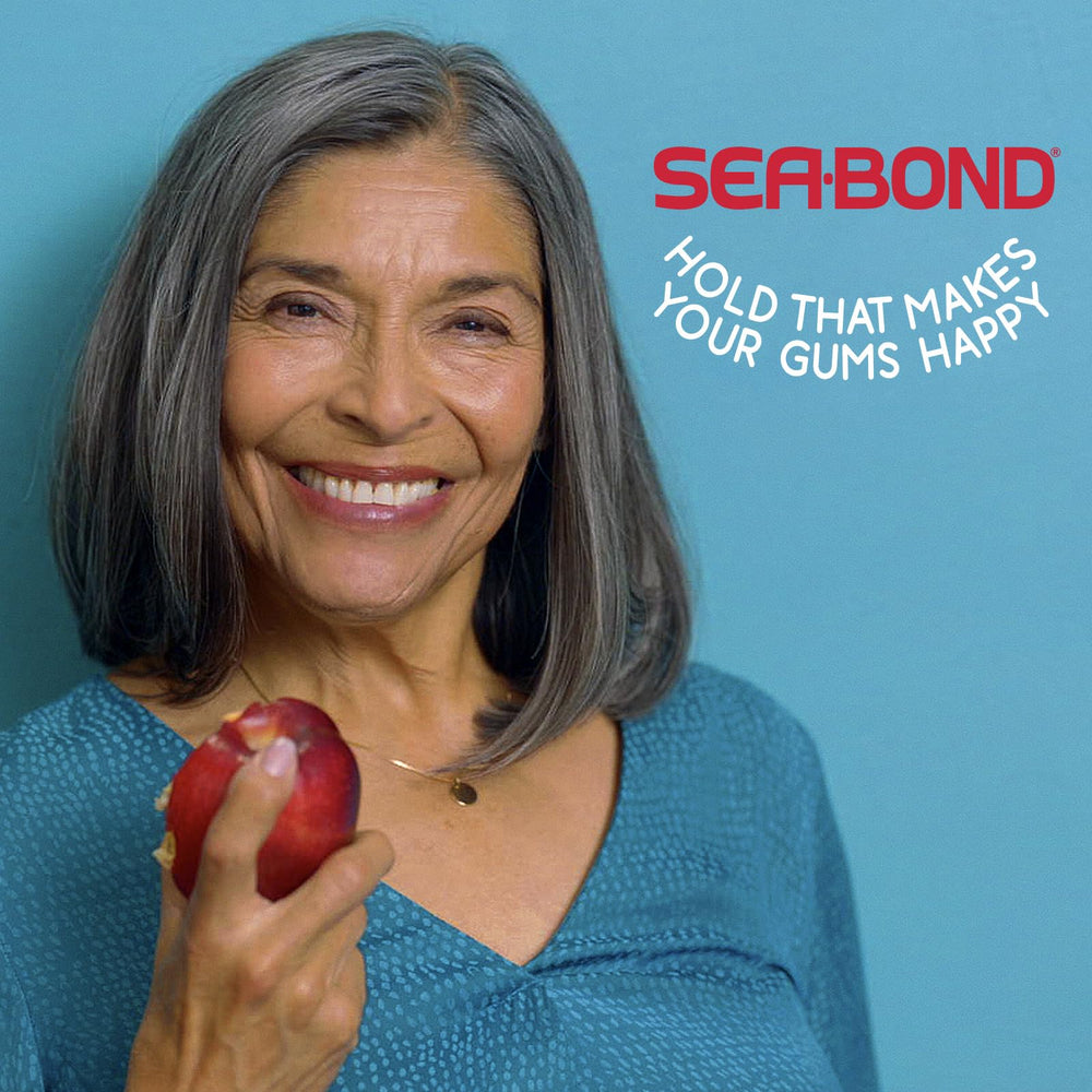 Sea‑Bond seal applied to denture base demonstrating secure fit