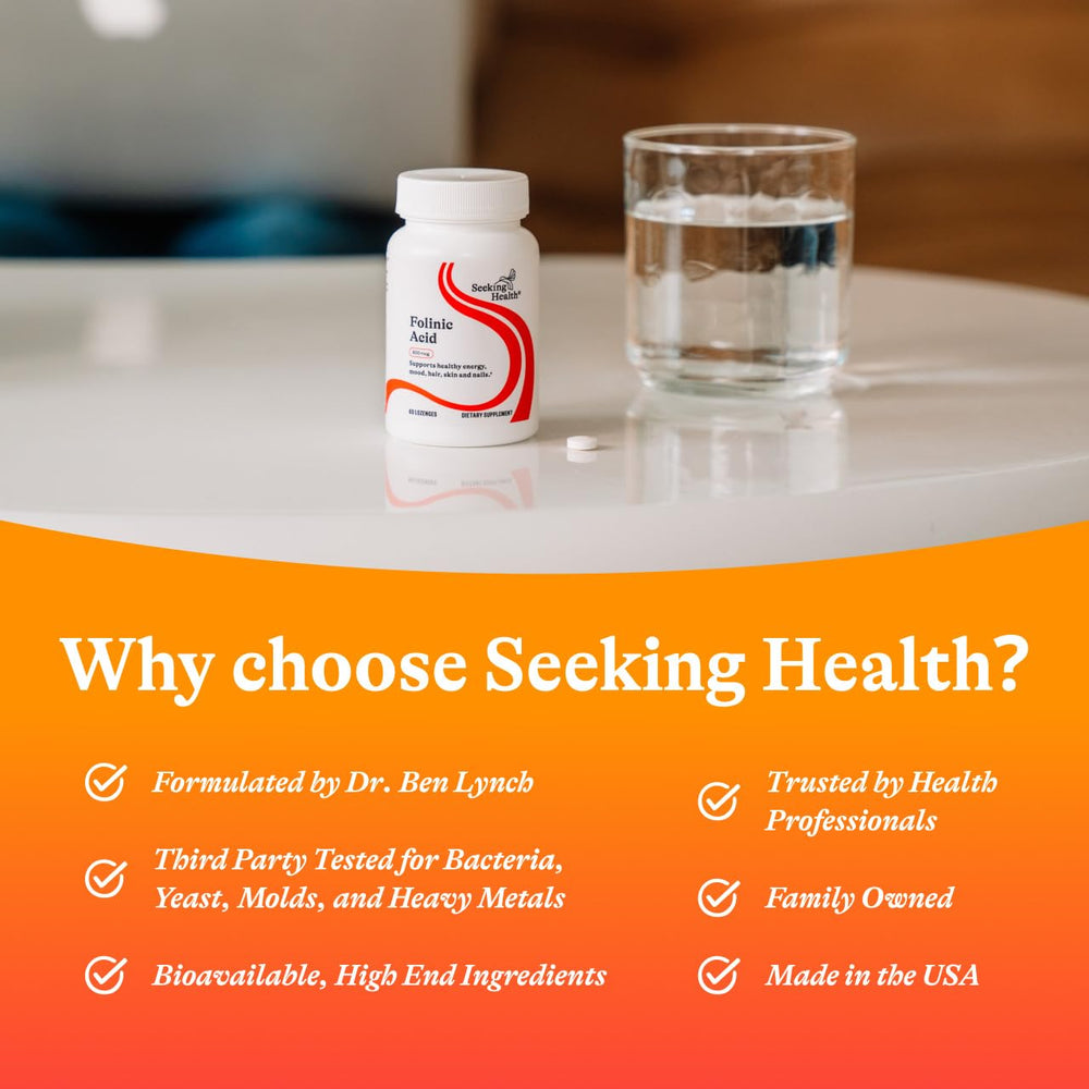 Seeking Health folinic acid lozenge beside a coin to show true-to-life size