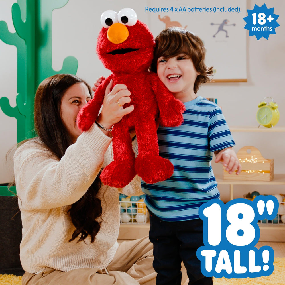 Sesame Street packaged Elmo with try-me tag indicating demo mode and included batteries