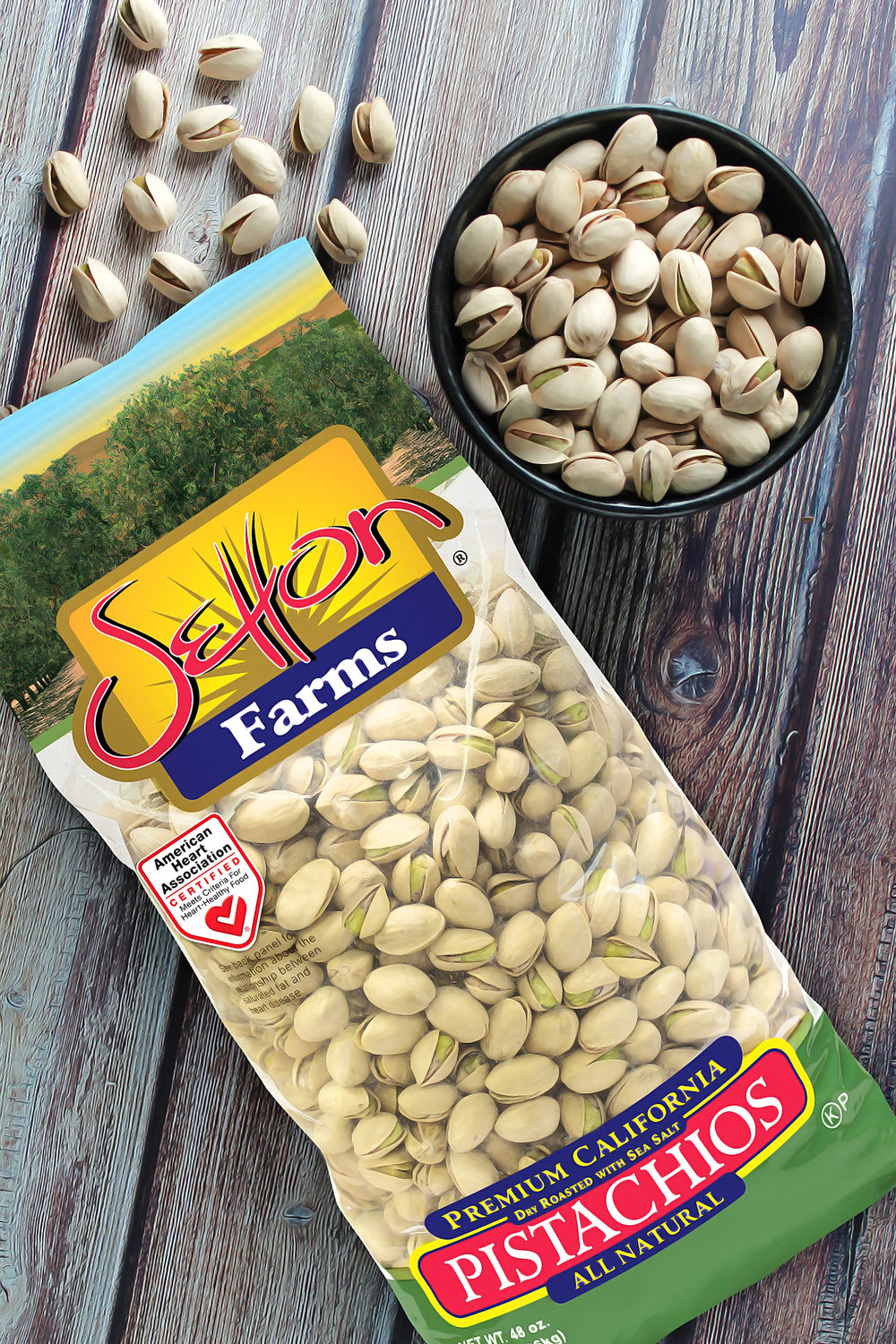 Setton Farms pistachios in a bowl beside snacks showing shareable serving