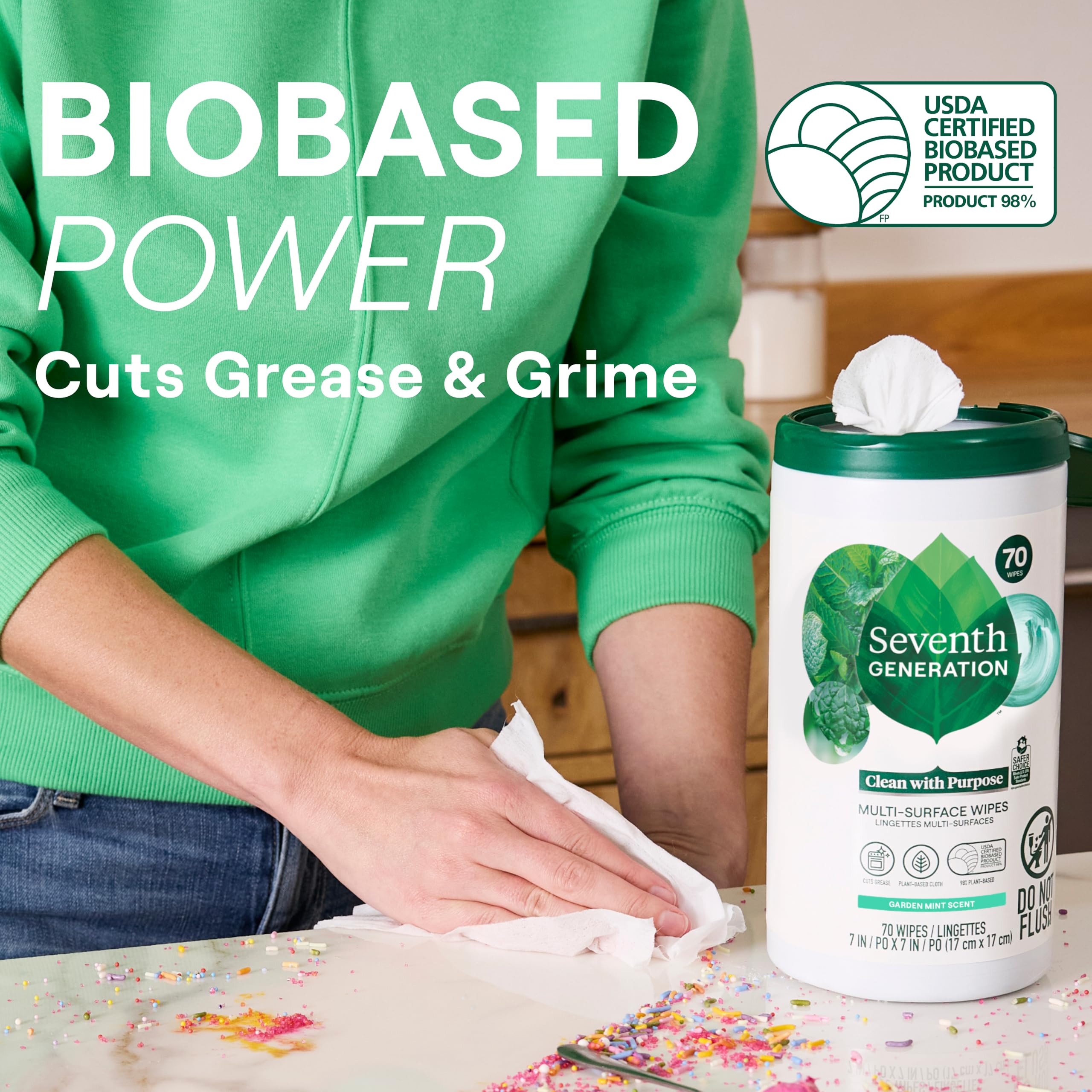 Seventh Generation wipe in hand removing a spill for quick cleanup benefit