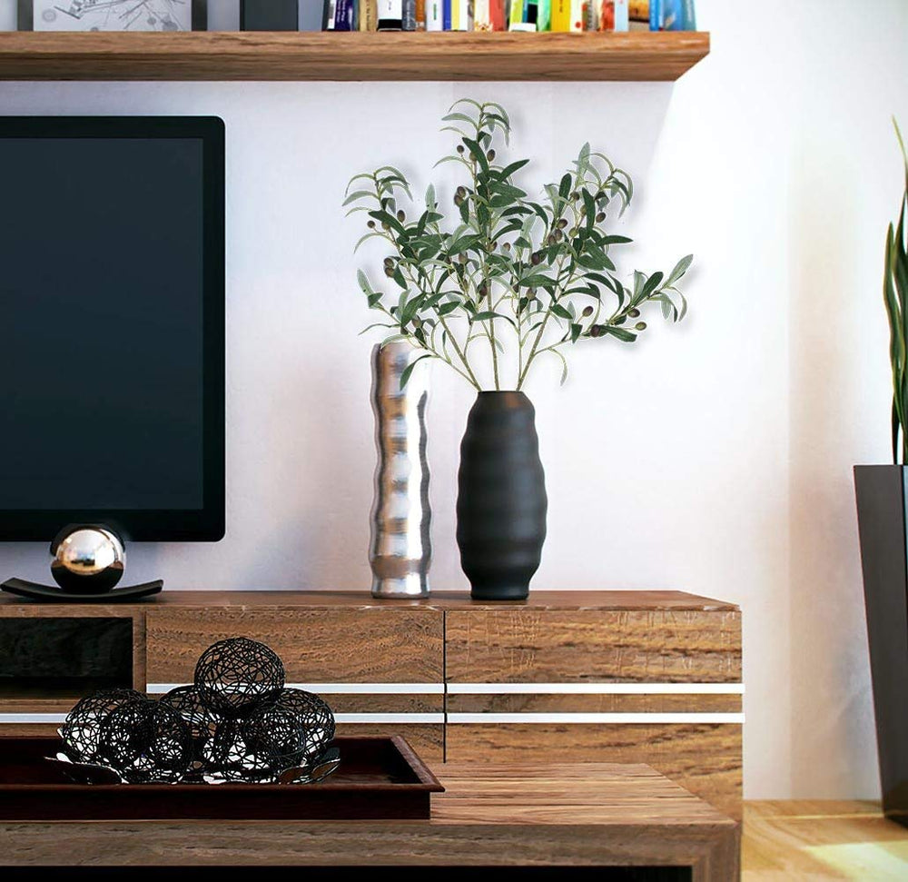SHACOS mantel display using olive stems to create natural focal point