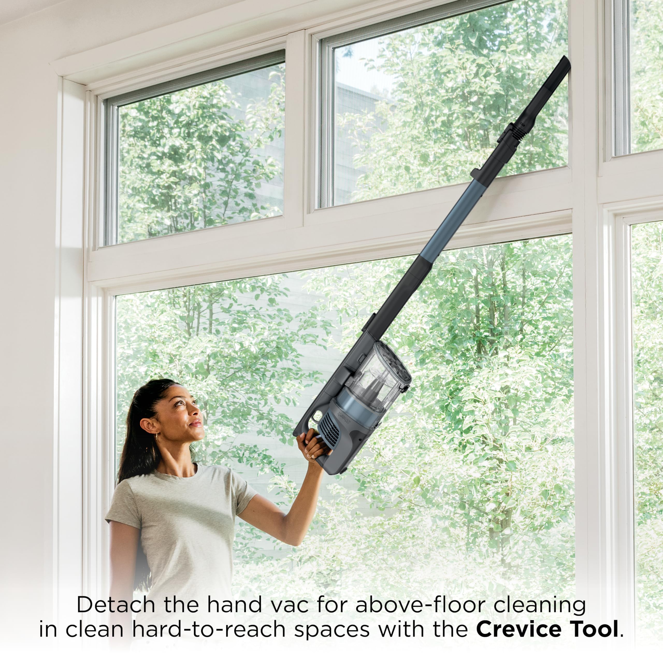 Shark IX141AMZ low-profile wand sliding under a sofa to reach hidden dust
