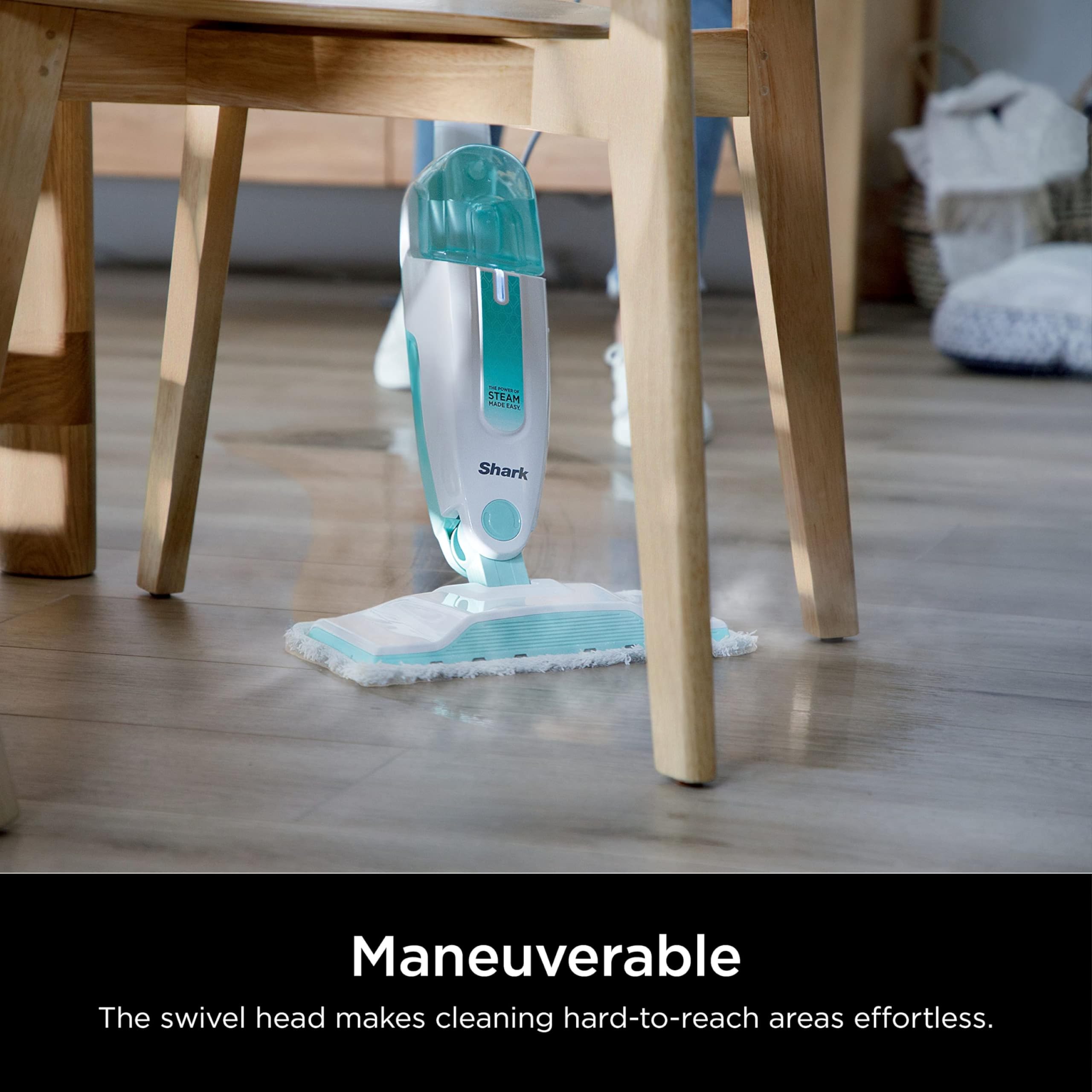 Shark S1000 next to a chair to show lightweight scale and portability