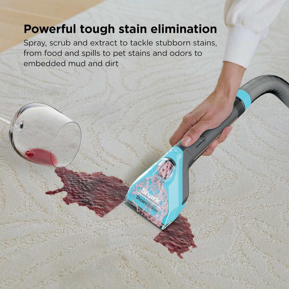 Shark StainStriker HairPro self-cleaning port in use, quickly flushing hose and tools