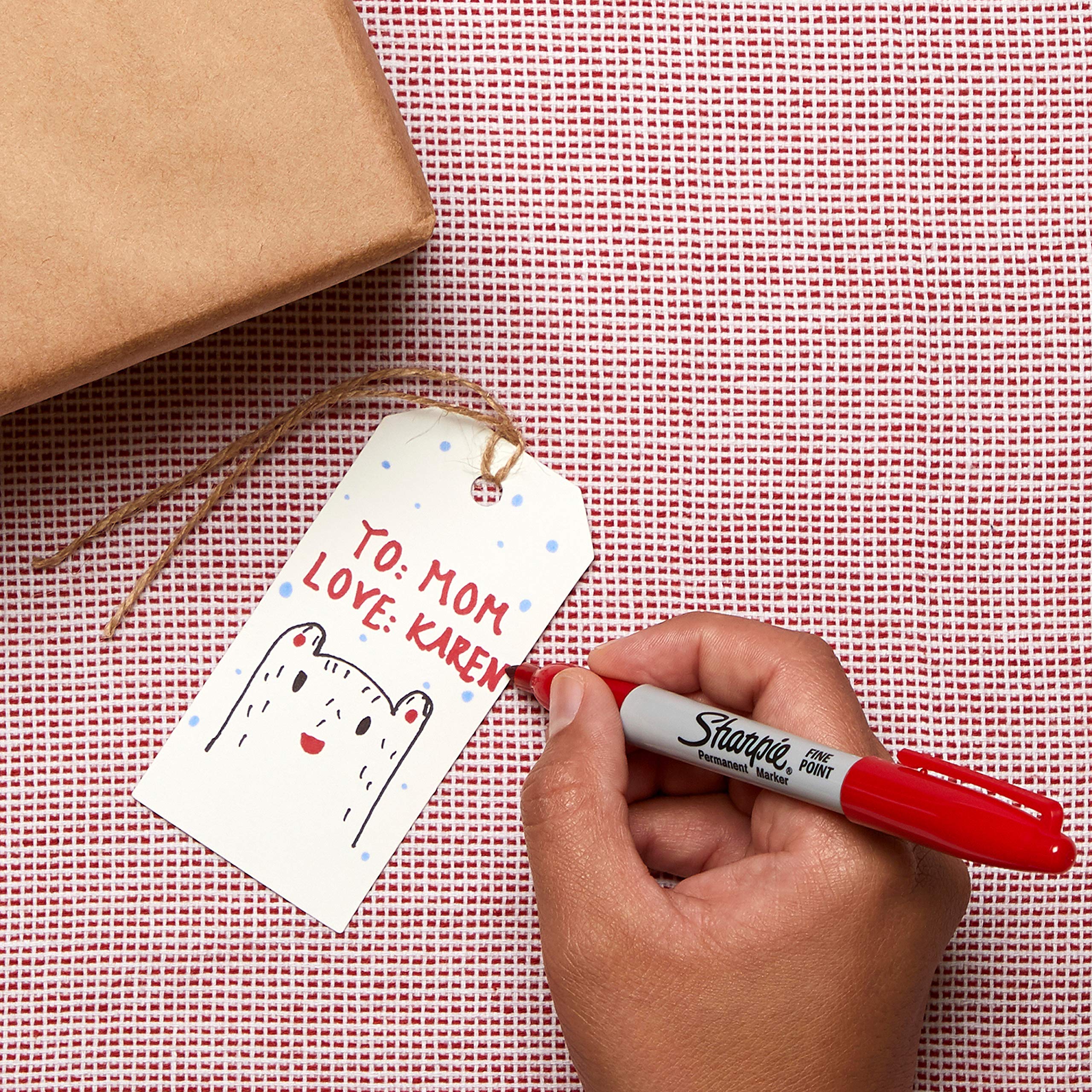 Sharpie fine-tip red next to ruler for scale showing consistent tip width