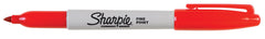 Sharpie fine-tip red writing sample on paper demonstrating bold, clear lines