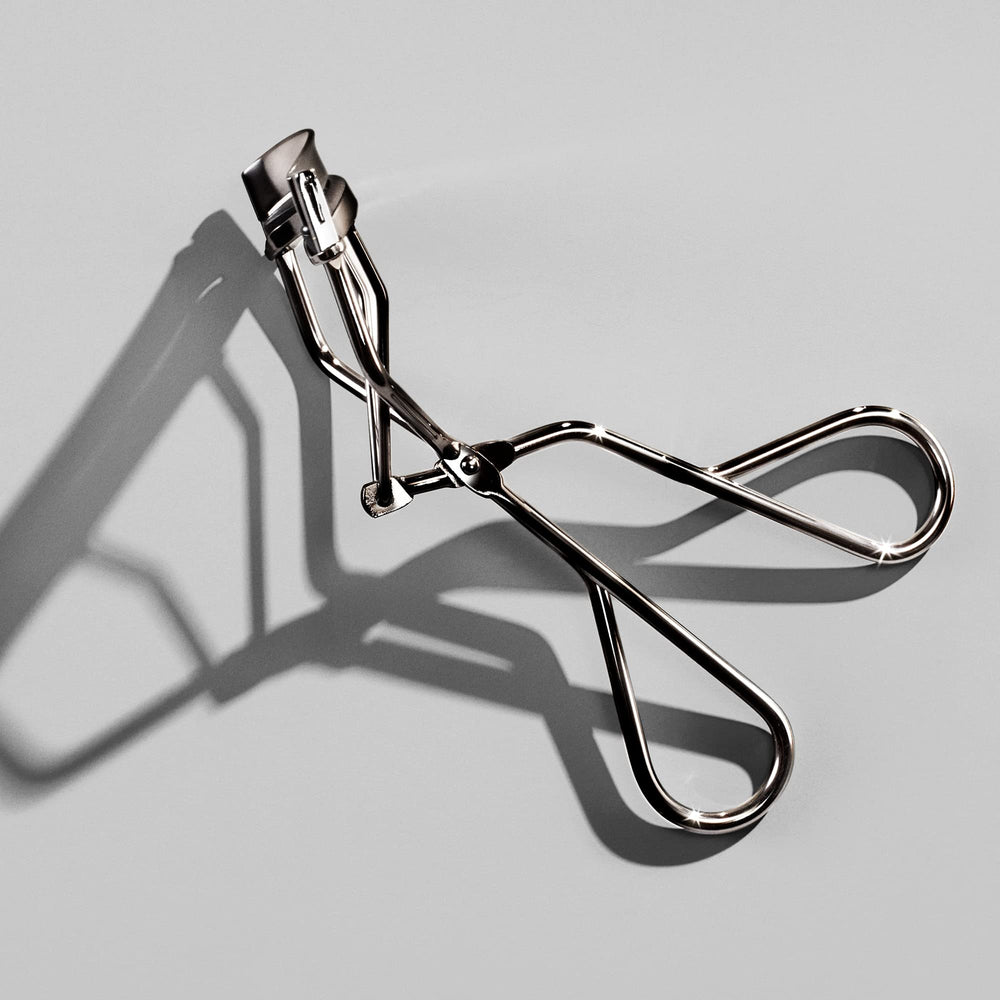 Shiseido eyelash curler before and after lashes showing enhanced eye framing