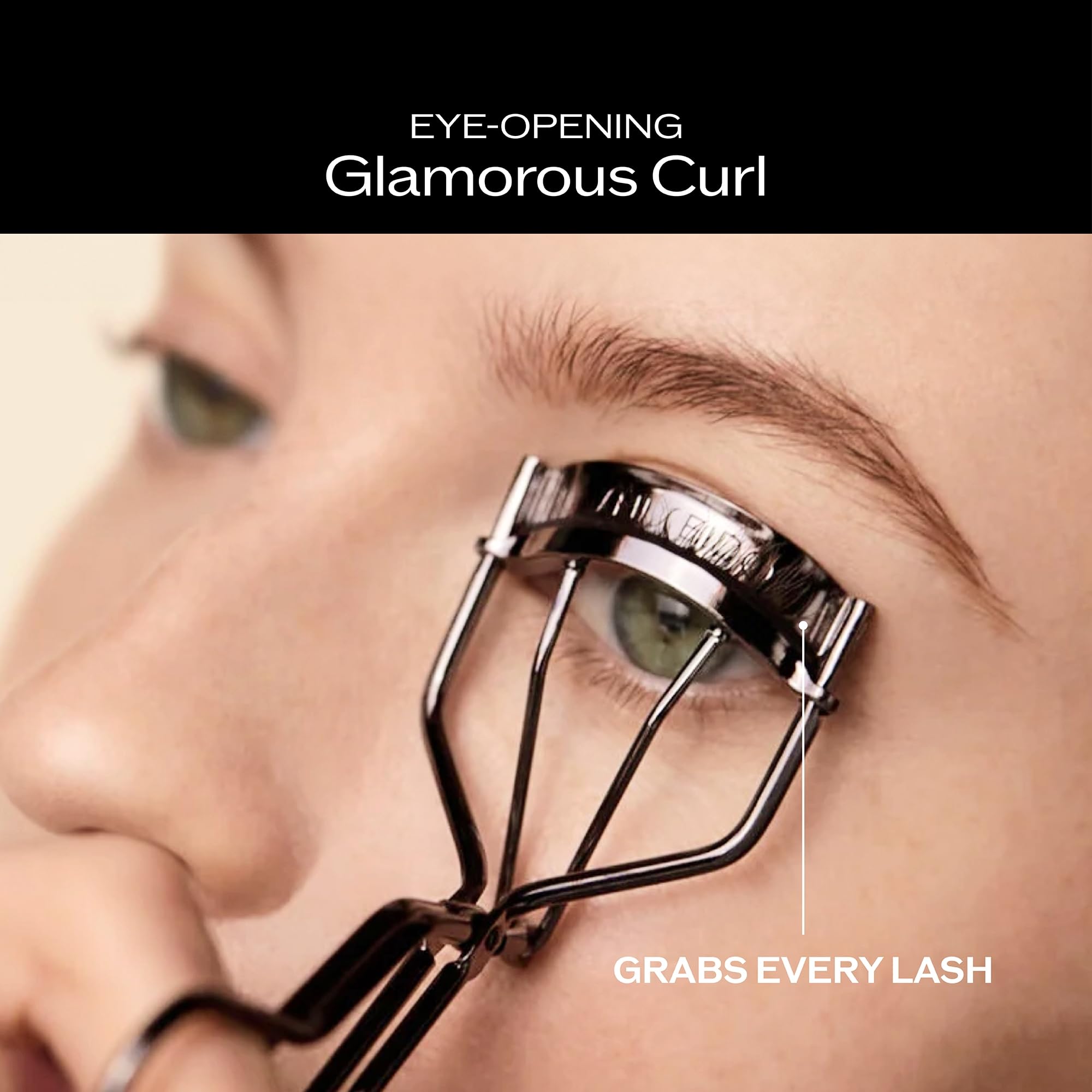 Shiseido eyelash curler open clamp detail illustrating broad curve coverage
