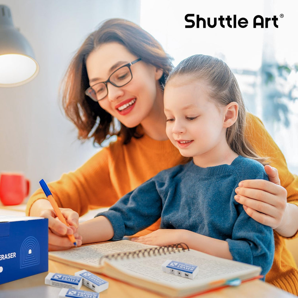 Open box of Shuttle Art erasers scattered to show bulk quantity advantage