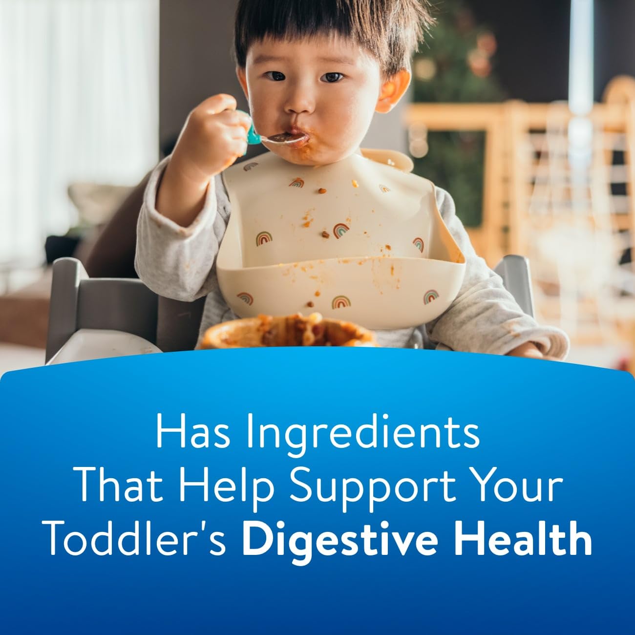 Similac Go & Grow 360 toddler drinking in kitchen, depicting everyday mealtime support