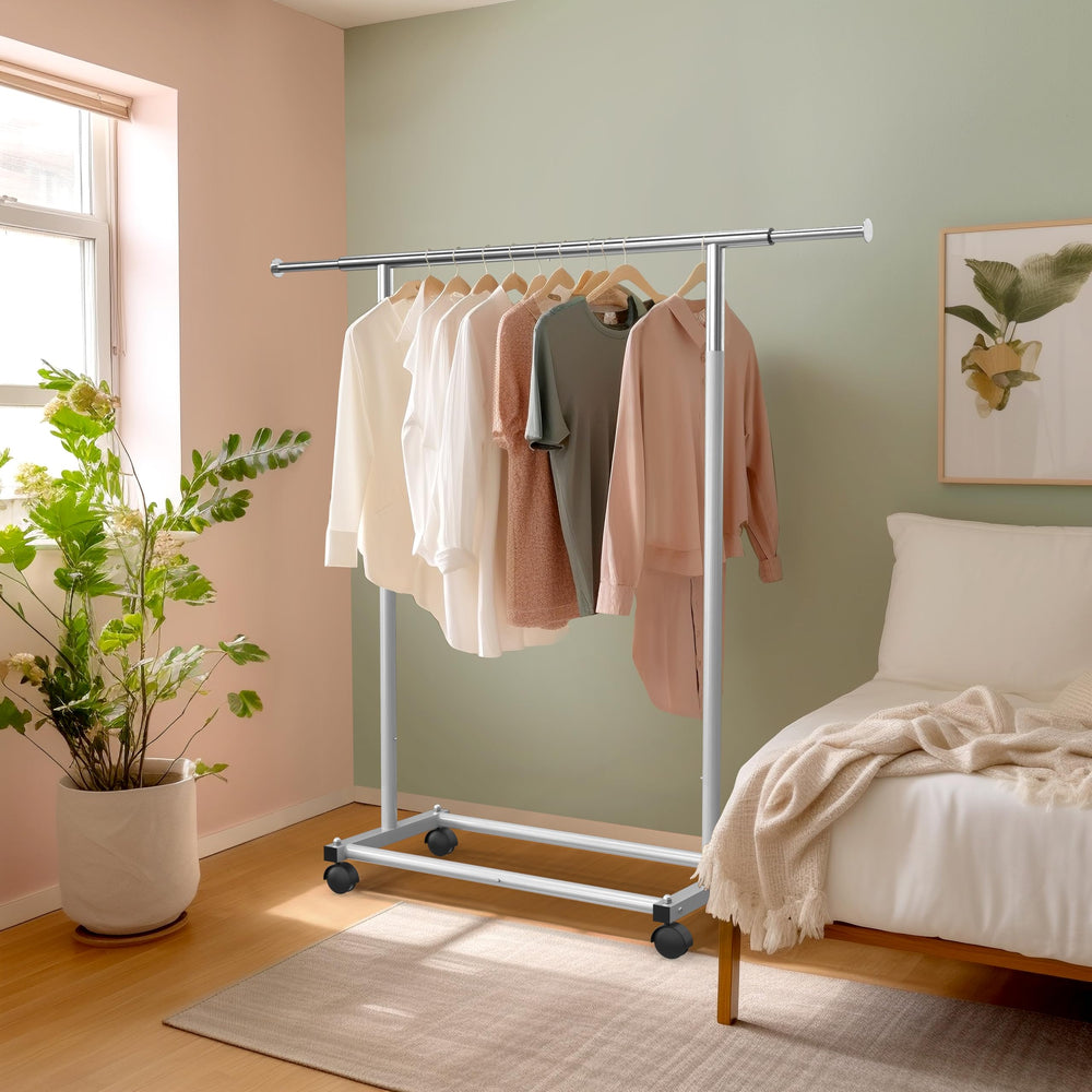 Simple Houseware garment rack in bedroom scene demonstrating space-saving organization benefit