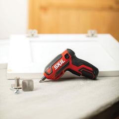 SKIL screwdriver held in hand to show scale and ease of maneuvering in tight spots